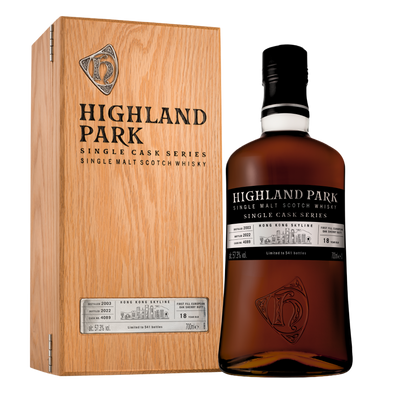 Highland Park whisky bottle and wooden box on a white background